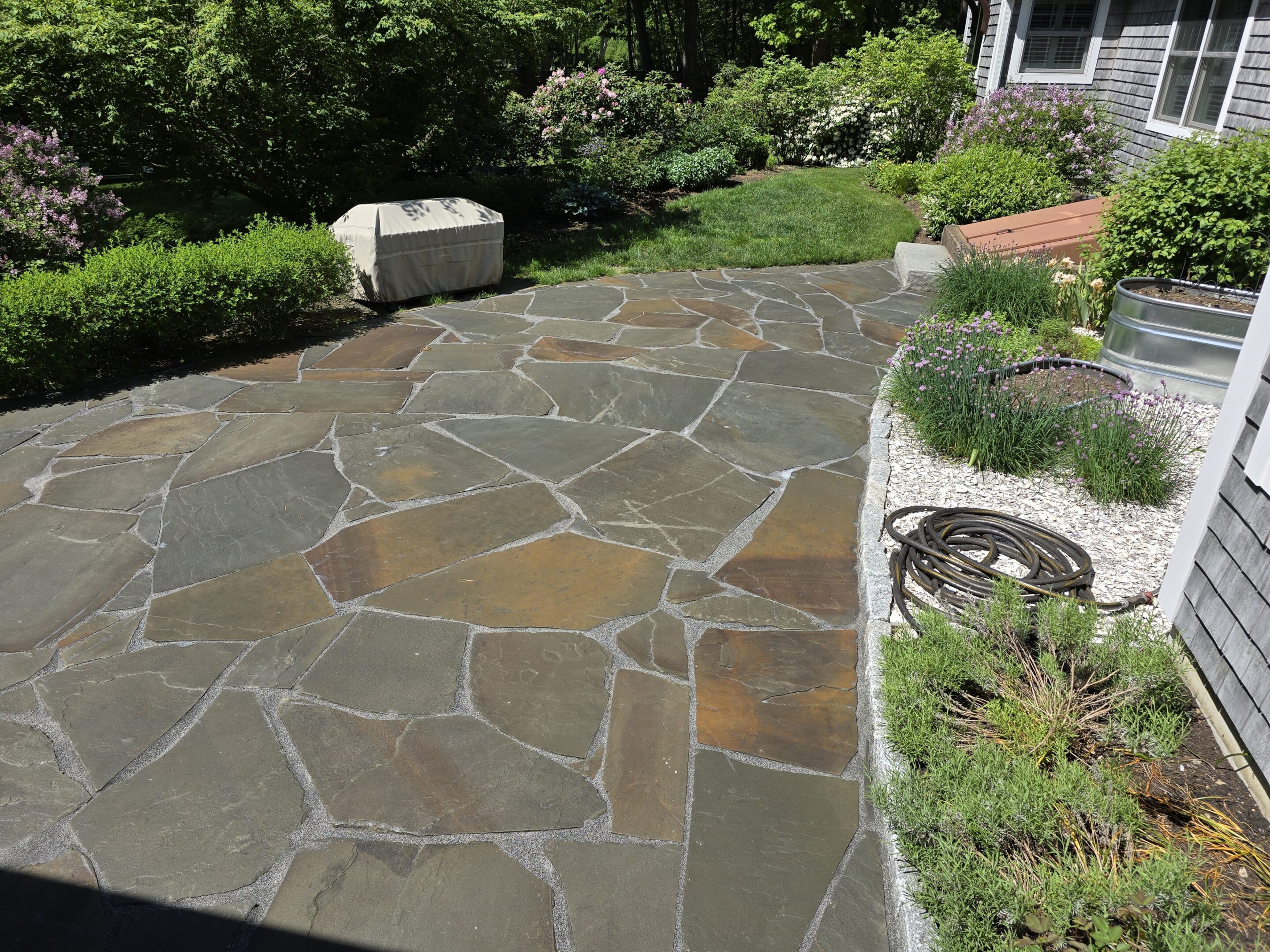A driveway with many different types of stones.